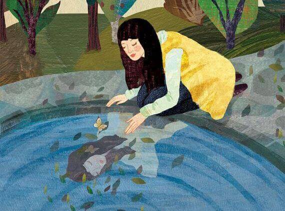 水面を覗き込む女性