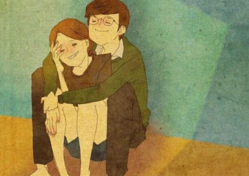 A sitting couple is hugging