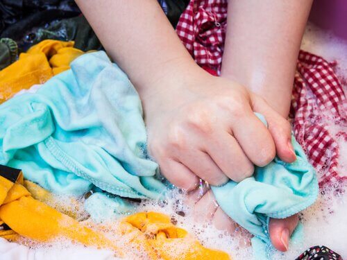 Washing clothes by hand